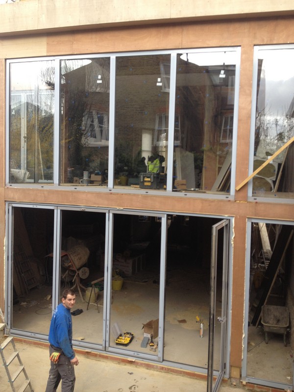 Aluminium bi-fold doors with two-storey glazing in Milton Keynes
