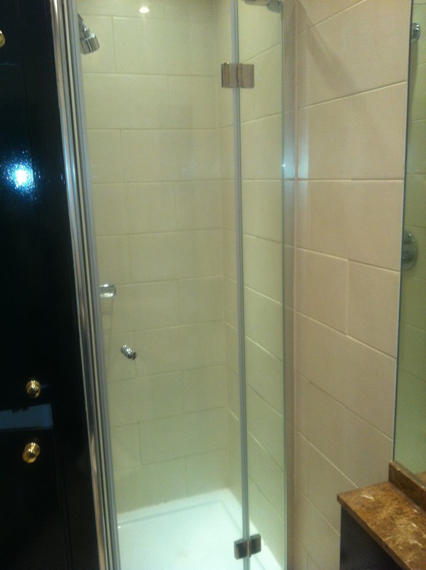 Frameless glass shower enclosure with chrome fittings in Milton Keynes