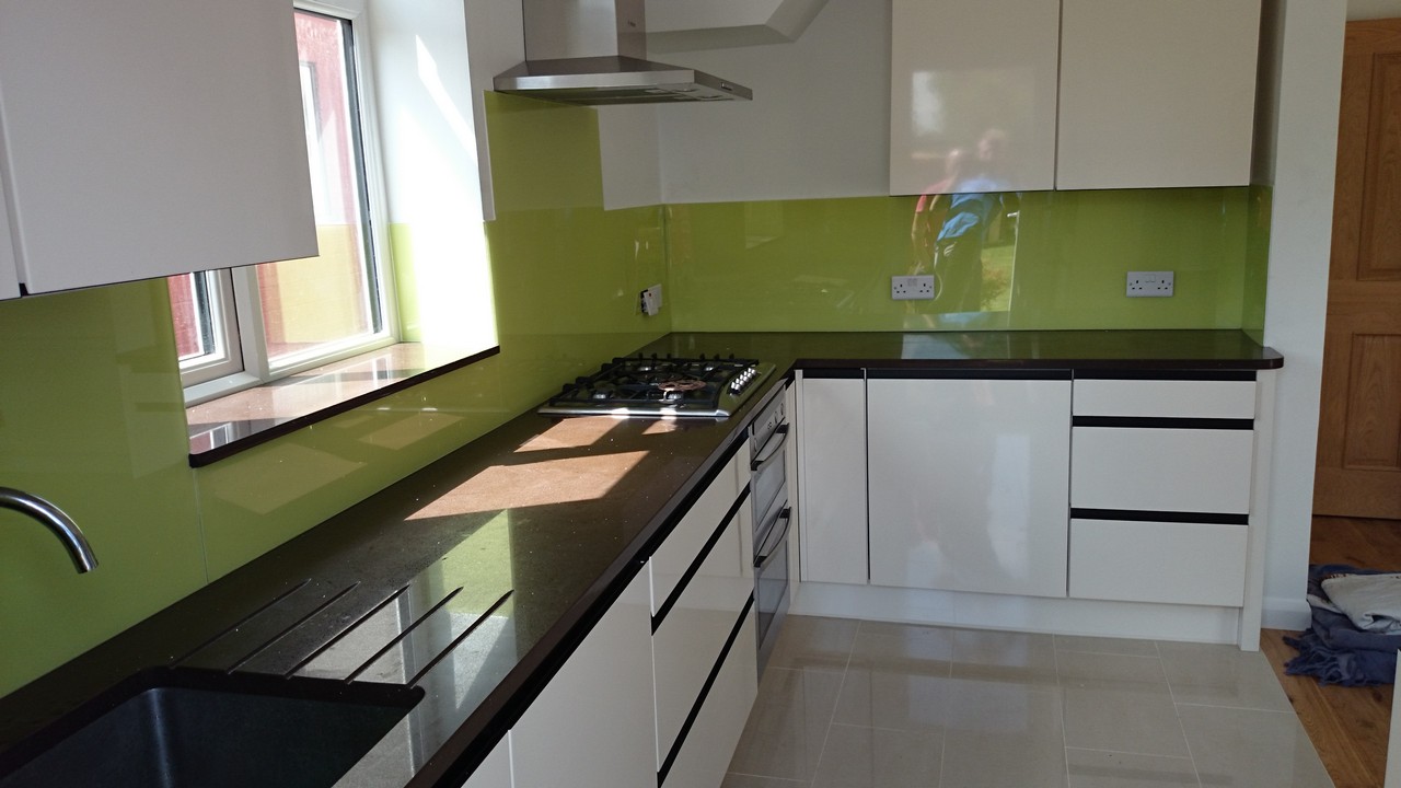 Lime green glass kitchen splashback installed by Milton Keynes glaziers
