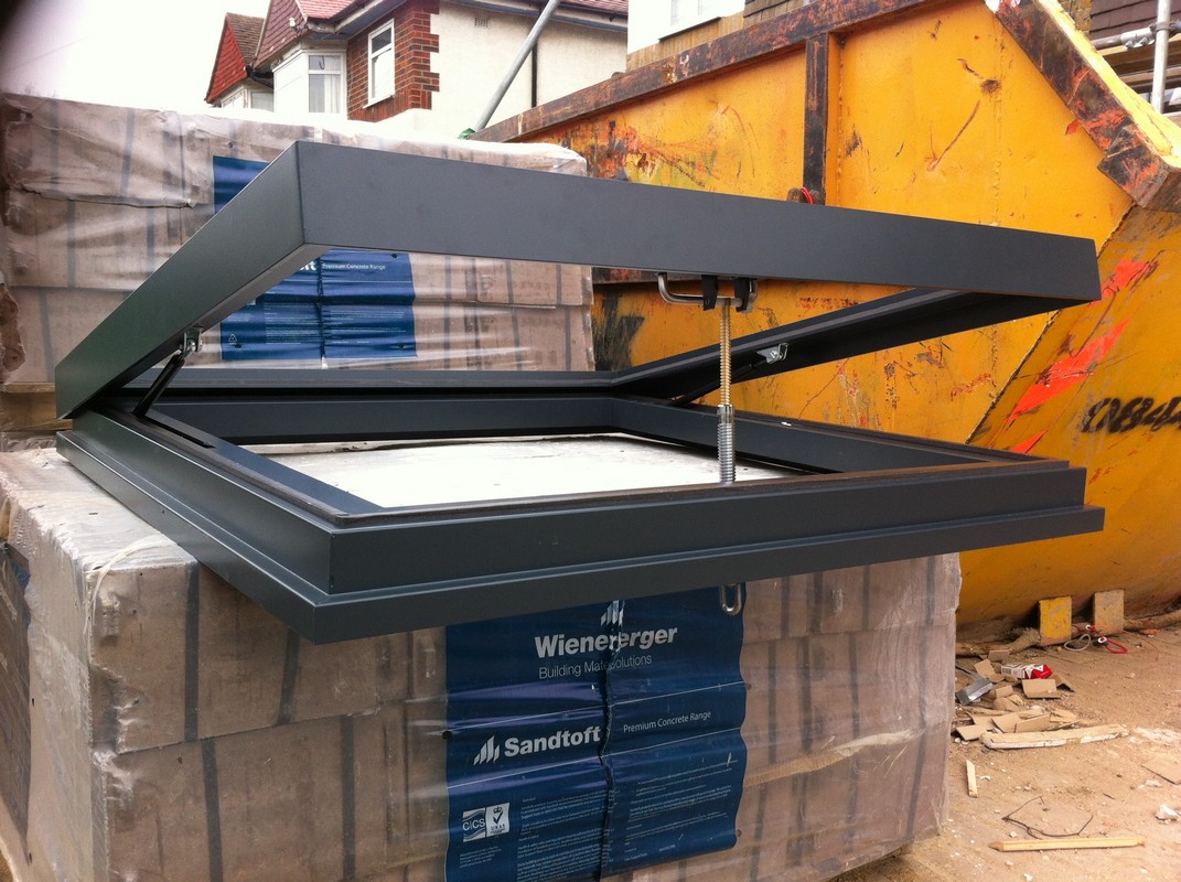 Opening flat roof skylight in anthracite grey installed in Milton Keynes